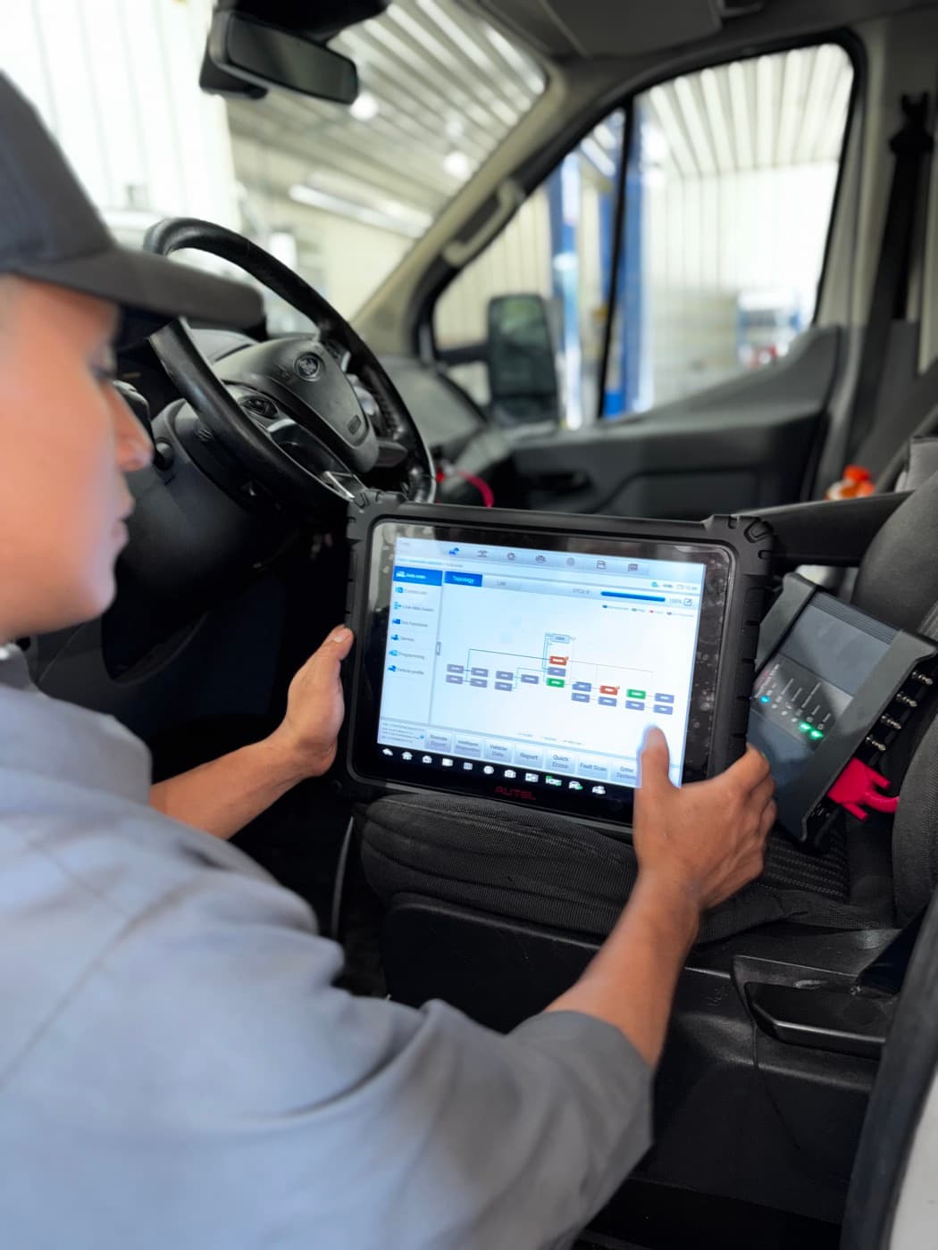 Diagnostic tablet showing which vehicle modules are communicating